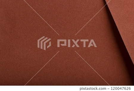 Designer paper background with a velvety, matte texture in warm, earthy hues like terracotta, ochre, 120047626