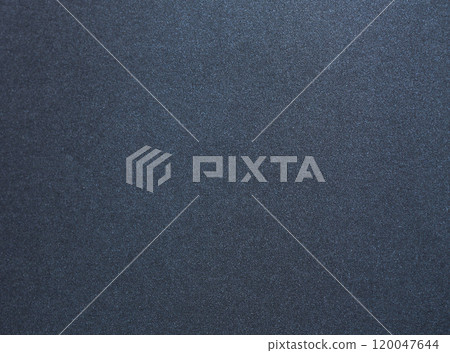 Luxurious designer paper background in deep navy blue with a smooth, satin like texture and subtle 120047644