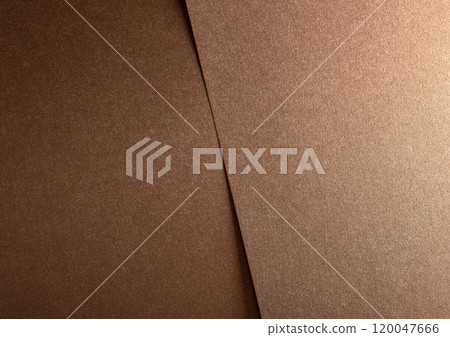 Glossy designer paper background with a bronze and copper gradient, featuring a shimmering metallic Glossy designer paper background with a bronze and copper gradient, featuring a shimmering metallic 120047666