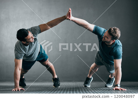 Happy men, high five and fitness with push ups for workout, exercise or training together at gym. Active male person or friends touching hands in success for muscle gain, winning or teamwork on floor Happy men, high five and fitness with push ups for workout, exercise or training together at gym. Active male person or friends touching hands in success for muscle gain, winning or teamwork on floor 120048097