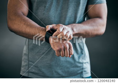 Fitness, smart watch and hands of man in studio for health data or monitoring vitals for training. Sports, workout and athlete with digital time piece for wellness tracking by gray background. 120048140