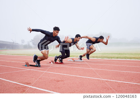 Race, fitness and men on track for training, marathon exercise and workout in stadium. Sports, athlete and people at start line for performance, endurance and challenge for running competition 120048163