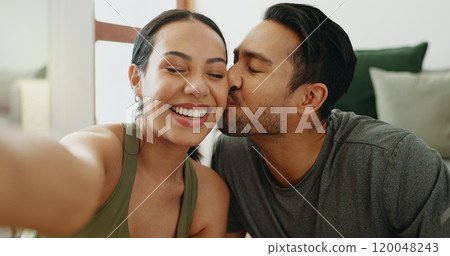 Selfie, happy and couple on sofa kiss for bonding, relationship and relax together in home. Dating, new house and face of man and woman take photo for profile picture, social media and online post 120048243