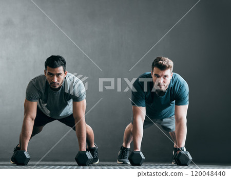Men, portrait and weightlifting with dumbbells at gym for pushups, workout or exercise on gray wall background. Man or friends lifting weight in fitness for training or muscle gain together on mockup 120048440