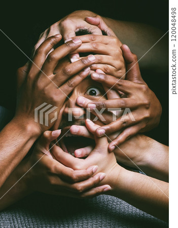 Terror, portrait and man with hands on face in fear, trauma and overwhelmed with mental health in studio. Horror, violence and scared person with depression, anxiety and stress on black background 120048498