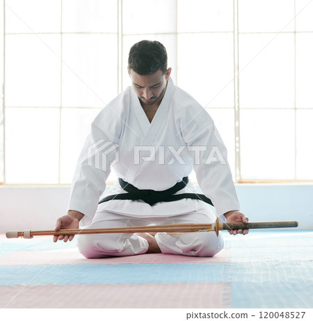 Bojutsu, karate and man with martial artist, training and discipline with commitment in dojo. Person, studio and guy with weapon, black belt and power with meditation, practice and workout with skill Bojutsu, karate and man with martial artist, training and discipline with commitment in dojo. Person, studio and guy with weapon, black belt and power with meditation, practice and workout with skill 120048527