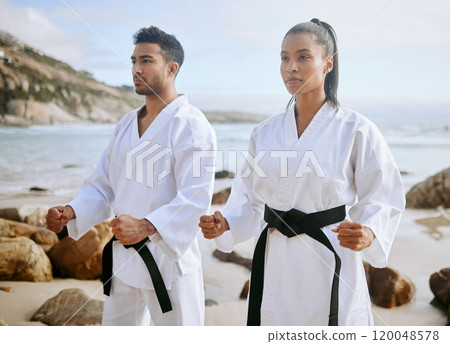 Karate, martial arts and people on beach for sports, practice and learning aikido, taekwondo and jiujitsu. Training, nature and man and woman by ocean for fitness, exercise and workout for tai chi 120048578