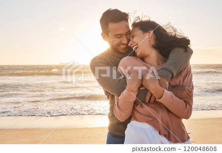 Love, sunset and couple with hug at beach for affection, relationship or weekend getaway. Travel, hispanic man and happy woman with embrace for vacation, anniversary or romantic date in Zanzibar 120048608