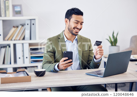 Office, smile and man with credit card by phone for online banking, payment and information. Happy, trader and fintech with laptop at desk for economy investment, transaction or stock market purchase 120048646