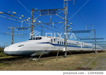 Shinkansen waiting in a depot (blue sky background) 120048886