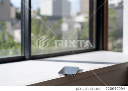 Smartphone by the window 120049004