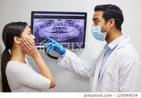 Dentist, communication and x ray of teeth on screen for patient education, dental diagnosis and treatment planning. Oral assessment, person and monitor for mouth scan for hygiene, health and wellness 120049034