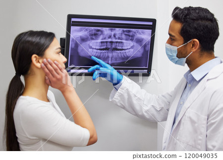 Dentist, consulting and x ray of teeth on screen for patient education, dental diagnosis and treatment planning. Oral assessment, person and monitor with mouth scan for hygiene, health and wellness 120049035