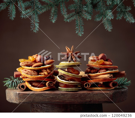 Christmas still-life with dried fruits and nuts. 120049236