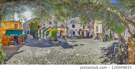 Charming street scene in Corte's historic old town, Corsica, with shops, church, and cobblestone paths 120049655