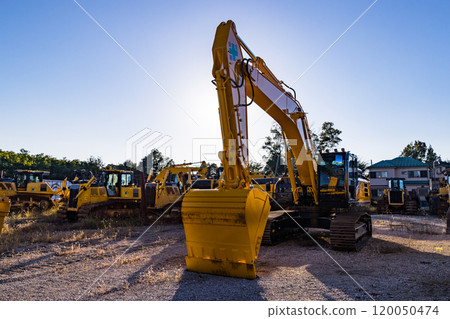 Heavy machinery excavator at a construction site 120050474