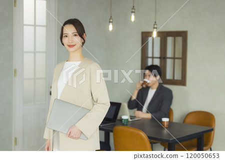 Young woman in a suit Young woman in a suit 120050653