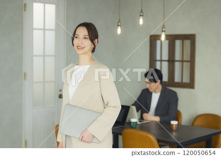 Young woman in a suit Young woman in a suit 120050654