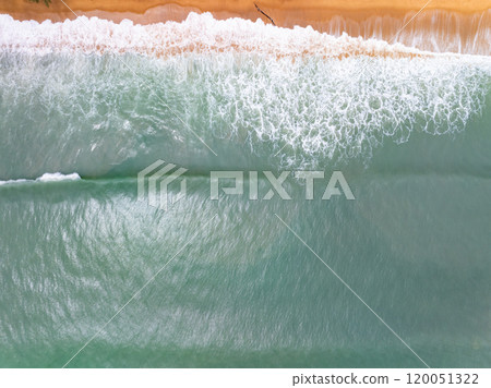 Top view sea surface waves crashing in summer season seascape background,Nature sea beach background,High angle view amazing waves,Wide angle image beach background Top view sea surface waves crashing in summer season seascape background,Nature sea beach background,High angle view amazing waves,Wide angle image beach background 120051322