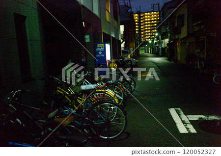 Residential street scene at night after the rain 120052327