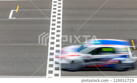 Motion blur race car racing on speed track, Car race on the international circuit race track crossing start and finish line, Race car crossing start and finish line, Target business achieve. 120052729