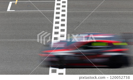 Motion blur race car racing on speed track, Car race on the international circuit race track crossing start and finish line, Race car crossing start and finish line, Target business achieve. 120052738