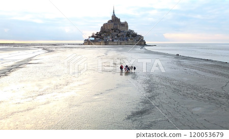 Visitors Walking Tidal Flats to Mont Saint-Michel, Normandy, northern France Visitors Walking Tidal Flats to Mont Saint-Michel, Normandy, northern France 120053679