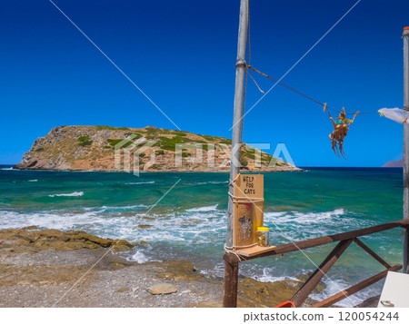 A view from the seaside of a fishing village across the rough sea to the island where the Minoan ruins remain (Mochlos, Crete, Greece) A view from the seaside of a fishing village across the rough sea to the island where the Minoan ruins remain (Mochlos, Crete, Greece) 120054244