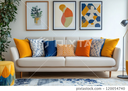 Stylish living room featuring a modern beige sofa with colorful cushions and vibrant wall art in a Stylish living room featuring a modern beige sofa with colorful cushions and vibrant wall art in a 120054740
