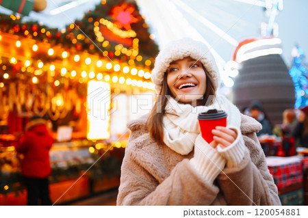 Woman enjoying winter moments. Festive Christmas fair, winter holidays concept. Woman enjoying winter moments. Festive Christmas fair, winter holidays concept. 120054881