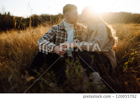 Stylish couple walking autumn weather. People, lifestyle, relaxation concept. Autumn Fashion concept Stylish couple walking autumn weather. People, lifestyle, relaxation concept. Autumn Fashion concept 120055782