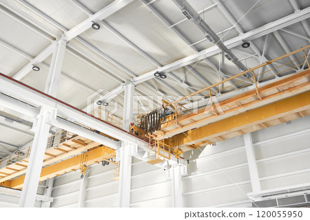 Overhead cranes inside industrial building 120055950