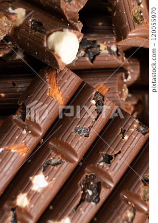 Close-up of milk nut chocolate. Healthy sweets, lactose-free and sugar-free chocolate 120055970