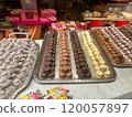 Assorted Chocolates and Truffles Displayed on Trays 120057897