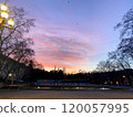 A park with a beautiful sunset and a fountain 120057995