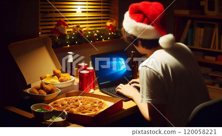 Man drinking tea on his laptop at home on Christmas Man drinking tea on his laptop at home on Christmas 120058221