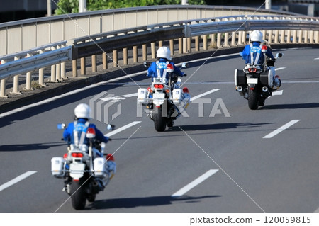A police motorcycle on patrol A police motorcycle on patrol 120059815