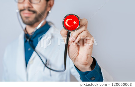 Doctor holding stethoscope with Turkey flag. Turkey Health and Care Concept, Turkish flag on stethoscope. Doctor holding stethoscope with Turkey flag. Turkey Health and Care Concept, Turkish flag on stethoscope. 120060008