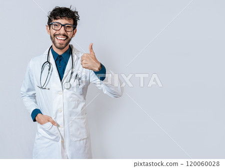 Smiling doctor giving thumb up isolated. Handsome doctor with thumb up smiling isolated. Young doctor with thumbs up gesture Smiling doctor giving thumb up isolated. Handsome doctor with thumb up smiling isolated. Young doctor with thumbs up gesture 120060028