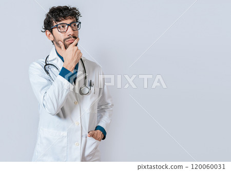 Doctor thinking with hand on chin. Young doctor thinking and looking up isolated, Pensive doctor man looking up isolated 120060031