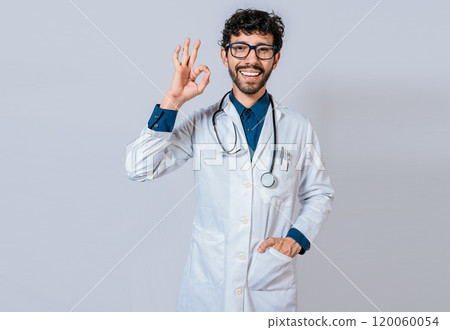 Happy doctor gesturing approval isolated. Handsome doctor approving and recommending isolated 120060054