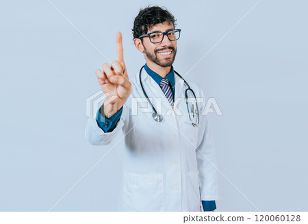 Doctor counting number ONE isolated. Handsome doctor counting number 1 on isolated background. Young doctor raising index finger isolated 120060128