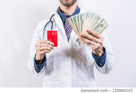Unrecognizable doctor holding money and credit cards isolated. Doctor hands holding credit card and money isolated 120060201