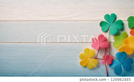 Background material of a cute colorful four-leaf clover placed on a wooden table 120062885
