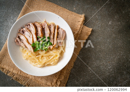 dried duck noodles in white bowl 120062994