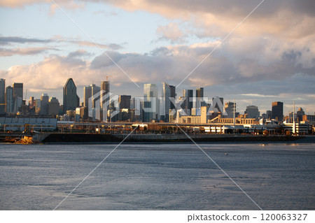 Montreal Downtown Cityscape with the St Lawrence River at Golden Hour with Sun Light. Montreal Downtown Cityscape with the St Lawrence River at Golden Hour with Sun Light. 120063327