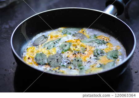 fried egg with sweet basil and holy basil in the pan fried egg with sweet basil and holy basil in the pan 120063364