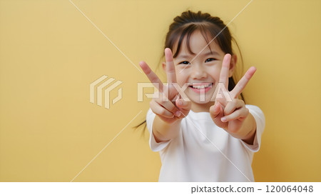 Asian Woman Happily Pointing to Upper Side with Both Fingers in Studio Asian Woman Happily Pointing to Upper Side with Both Fingers in Studio 120064048