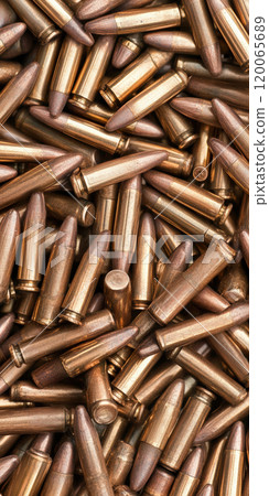 Ammunition background with metallic bullets in a pile for military and shooting themes, AI Generative 120065689