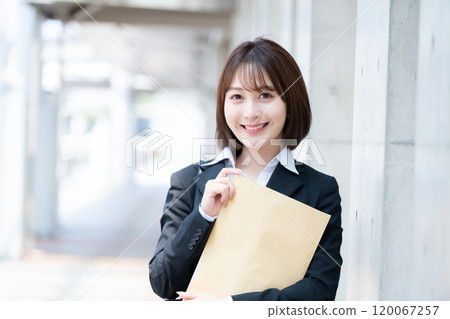 Businesswoman with document 120067257